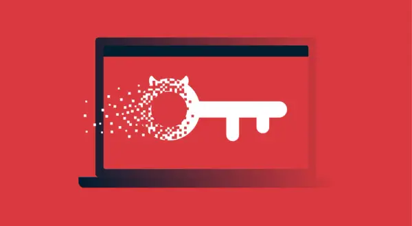 Klucz z pikseli rozpadający się na ekranie laptopa, symbolizujący zagrożenie typu hacktool win32.