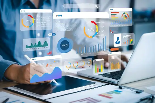 Analiza danych big data w czasie rzeczywistym. Wizualizacje wykresów i wskaźników na ekranach, osoba pracuje z danymi.
